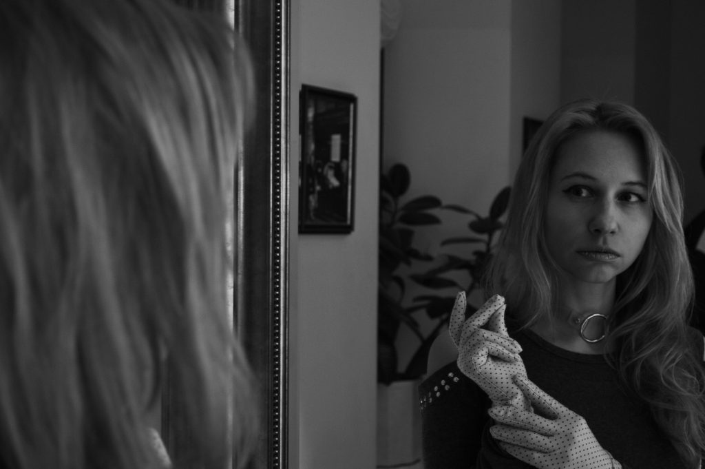 a Woman Looking in the Mirror