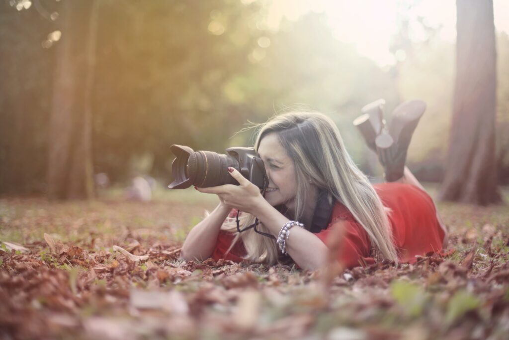 woman taking a picture following her passion and understanding why passion is the new currency