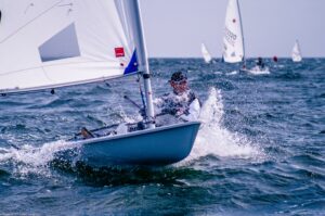 Man competitive sailing who knows the importance of sailing life lessons