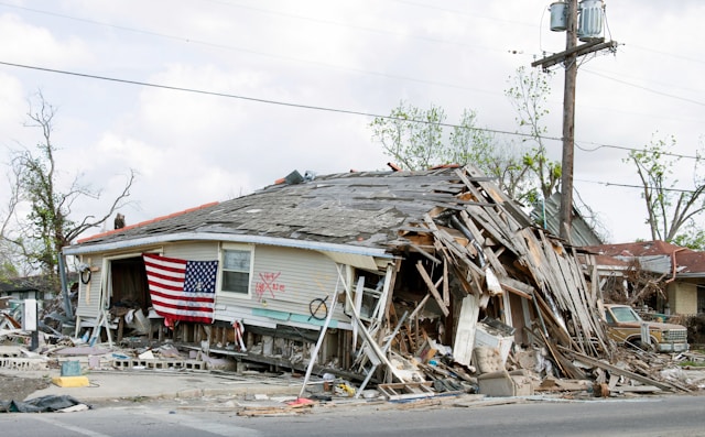 Picture of a house destroyed and the after math of rebuilding after a hurricane